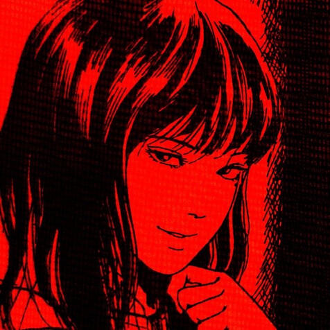 Junji Ito’s popular character Tomie. Colored black and red and smirking at the camera.